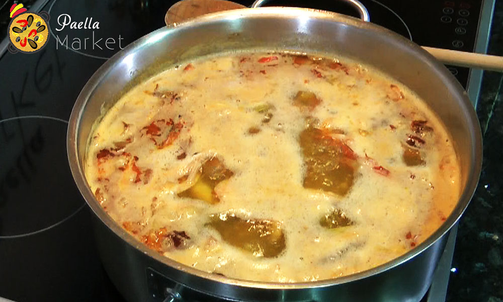 Paella fish stock cooking